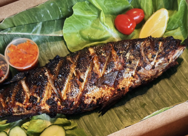 Charcoal-grilled Seabass on banana leaf