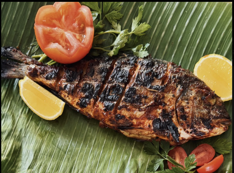 Charcoal-grilled Indonesian fish on banana leaf
